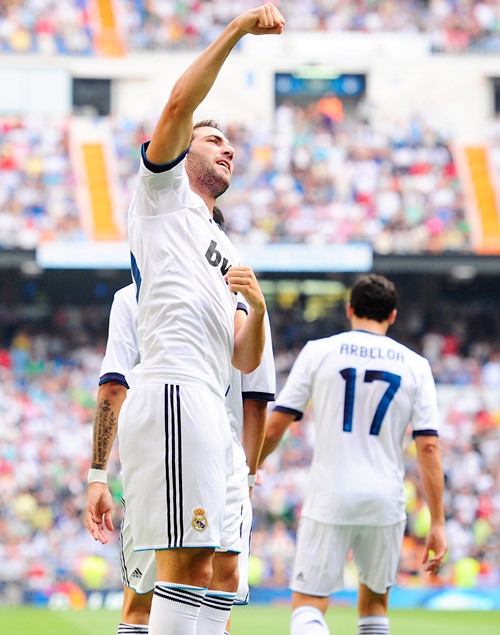 Gonzalo Higuain of Real Madrid celebrates with teammates