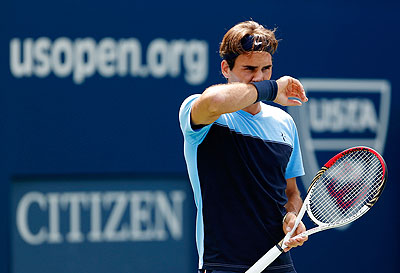 Roger Federer practices prior to the start of the 2012 US Open at the USTA Billie Jean King National Tennis Center