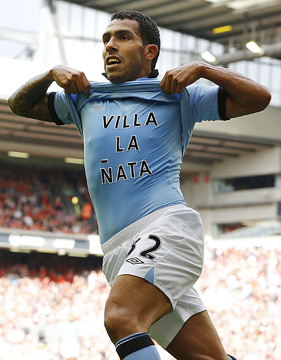 Manchester City's Carlos Tevez celebrates after scoring against Liverpoolon Sunday