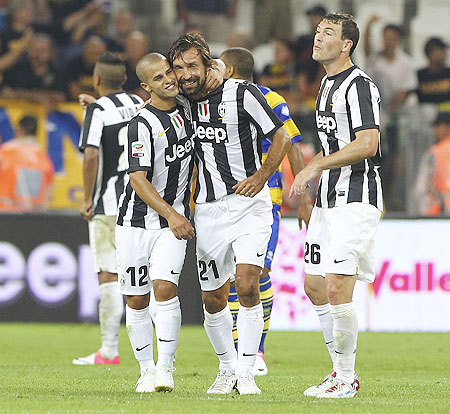 Andrea Pirlo (center) of Juventus FC celebrates with teammate Sebastian Giovinco (left) after scoring against Parma FC on Saturday