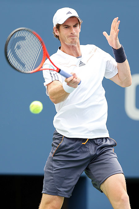 Andy Murray returns a shot against Alex Bogomolov Jr  during their men's singles first round match of the US Open on Monday