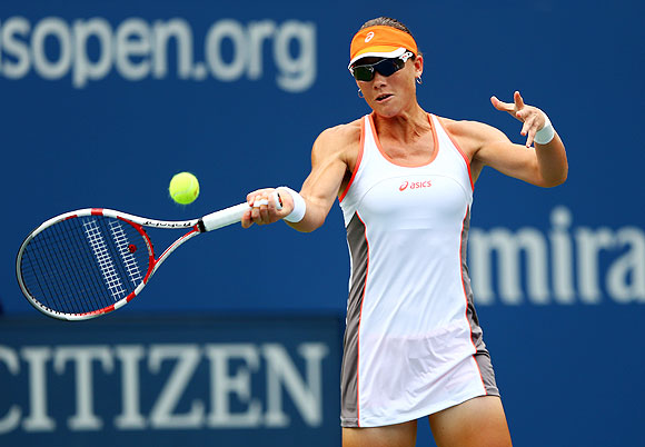 Samantha Stosur returns against Petra Martic in the first round of the US Open on Monday