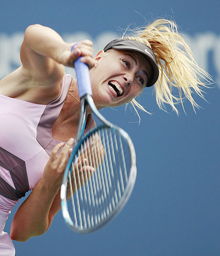 Maria Sharapova serves to Melinda Czink during their women's first round singles match at the US Open on Monday