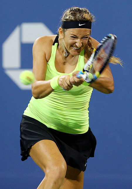 Victoria Azarenka plays a return against Alexandra Panova during their first round match of the US Open on Monday