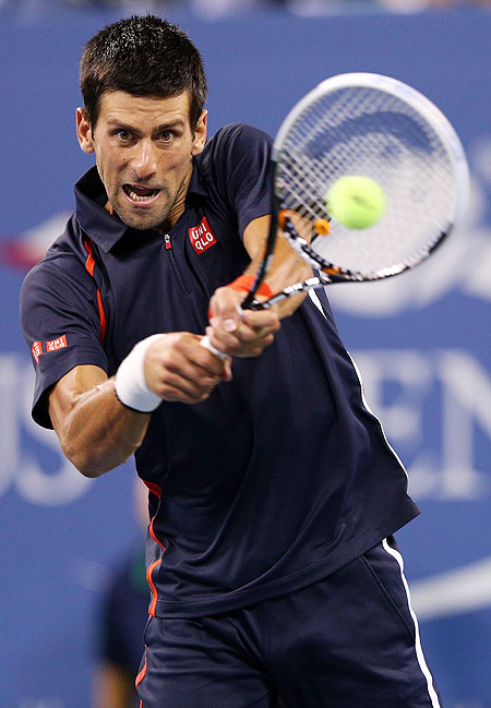 Novak Djokovic returns a shot against Paolo Lorenzi during their first round match on Tuesday