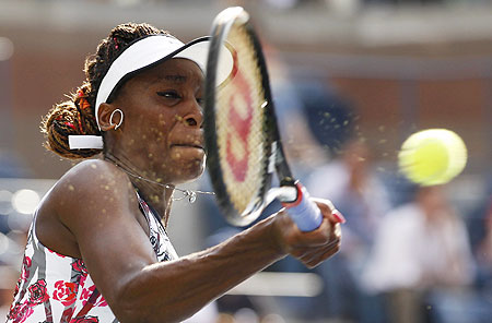 Venus Williams hits a return to compatriot Bethanie Mattek-Sands during their first round match on Tuesday