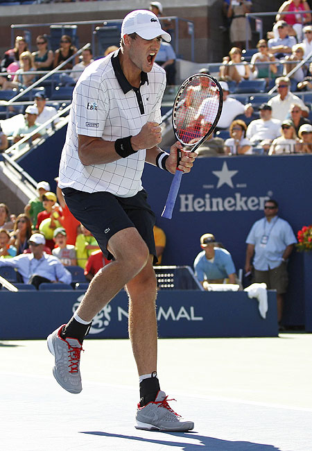 John Isner of the US celebrates after defeating Xavier Malisse of Belgium
