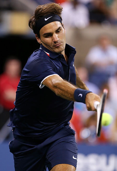 Roger Federer plays a return against Bjorn Phau on Thursday