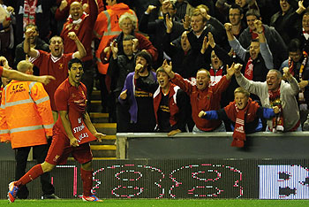 Liverpool's Luis Suarez celebrates after scoring against Hearts during their Europa League match on Thursday