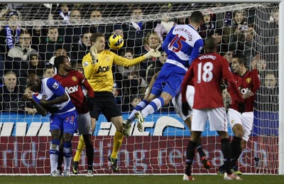 Reading's Sean Morrison (C) scores against Manchester United during their English Premier League soccer match at the Madejski Stadium
