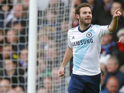 Juan Mata of Chelsea celebrates after scoring his team's first goal against West Ham United during their English Premier League soccer match at Upton Park