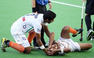 India's Rupinder Pal Singh tries to comfort teammate Manpreet Singh 