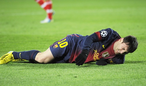 Barcelona's Lionel Messi reacts after picking up an injury