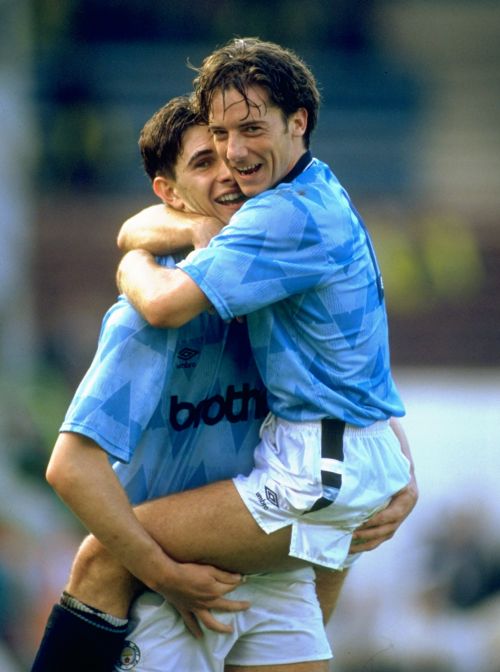 Ian Bishop and Paul Lake of Manchester City celebrate victory against Manchester United