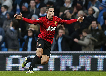 Manchester United's Robin Van Persie celebrates after scoring against Manchester City on Sunday