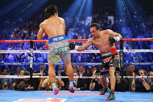 Juan Manuel Marquez throws a right at Manny Pacquiao