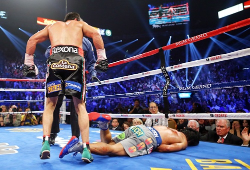 Manny Pacquiao lays face down on the mat after being knocked out