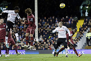 Fulham's Hugo Rodallega (left) scores against Newcastle United during their English Premier League match at Craven Cottage in London on Monday