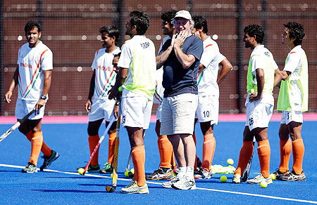 Coach Michael Jack Nobbs of India talks to his team