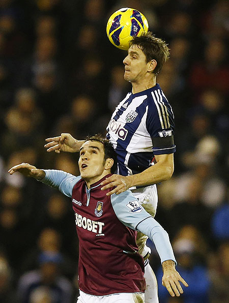 West Bromwich Albion's Zoltan Gera (right) and West Ham United's Joey O'Brien are involved in an aerial challenge on Sunday