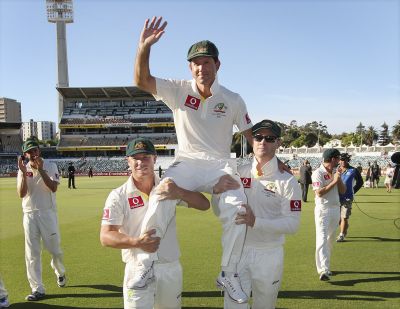 Australia's Ricky Ponting is carried off the WACA in Perth by team mates David Warner (L) and captain Michael Clarke after the third Test cricket match against South Africa