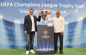 Former Italian footballer Christian Vieri and Brazil's World Cup winning captain Cafu pose with the UEFA Champions League Trophy during the Trophy Tour 2012/13