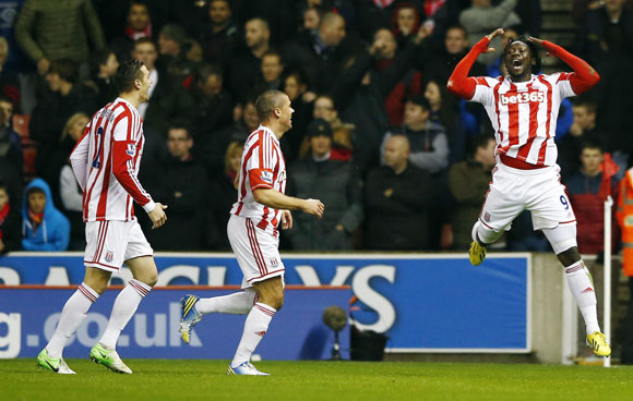 Stoke City's Kenwyne Jones (R) celebrates after scoring during their match against Liverpool at The Britannia stadium