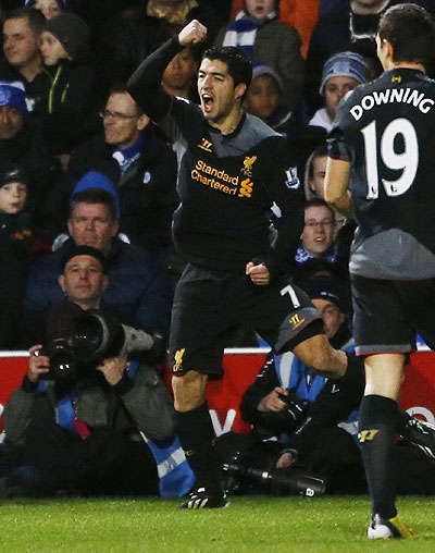Liverpool's Luis Suarez celebrates after scoring against Queens Park Rangers on Sunday