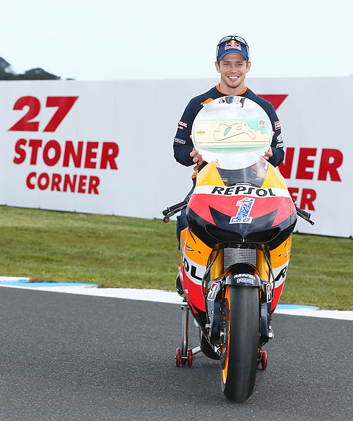 Casey Stoner of Australia and Honda Team poses with the 'Stoner Corner' trophy