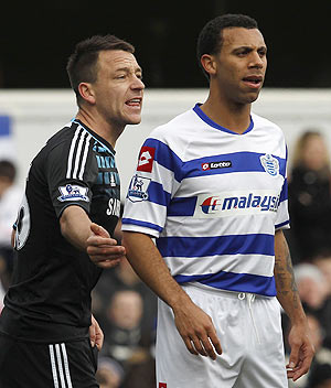 Queens Park Rangers' Anton Ferdinand (right) is marked by Chelsea's John Terry