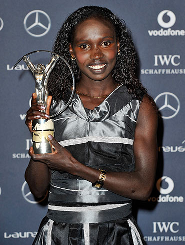 Vivian Cheruiyot poses with her Laureus World Sportswoman of the Year trophy
