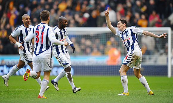 Keith Andrews (right) of West Bromwich celebrates with teammates after scoring against Wolves on Sunday