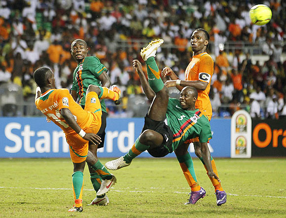 Zambia's Himoonde challenges Gradel of Ivory Coast during their African Nations Cup final soccer match in Gabon's capital Libreville