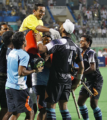 India's players hoist goalkeeper Bharat Kumar Chetri