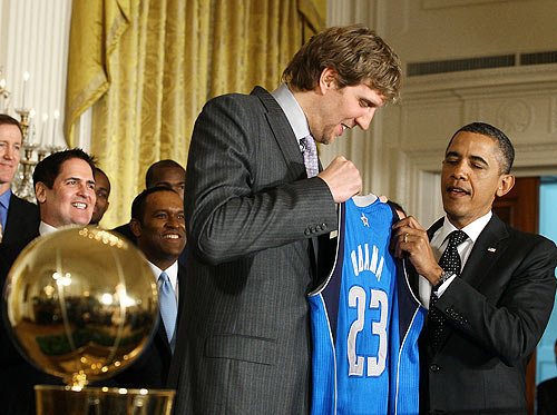 President Barack Obama (right) is given a jersey from Dirk Nowitzki of the Dallas Mavericks