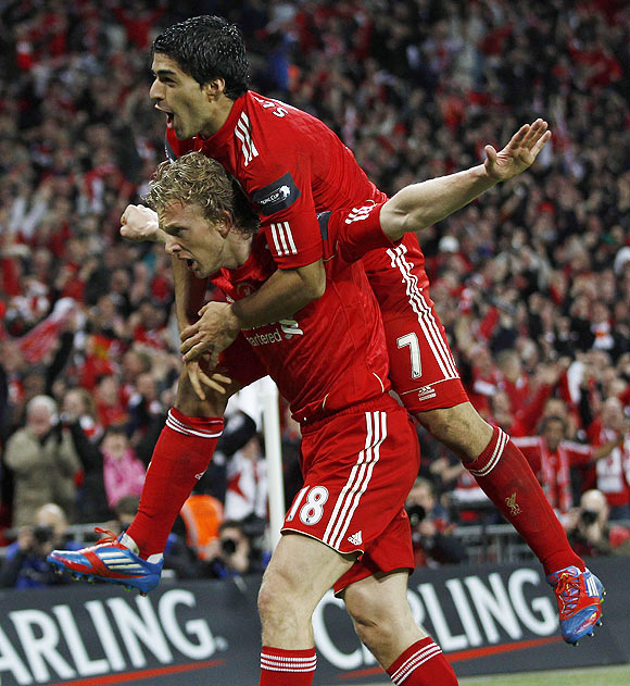 Liverpool's Dirk Kuyt (left) celebrates with Luis Suarez after scoring in extra time