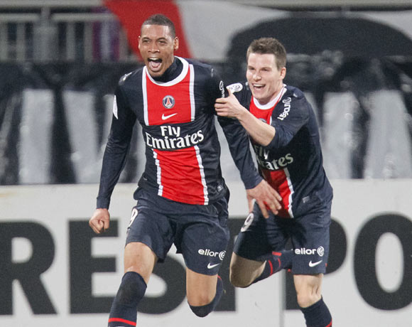 Guillaume Hoarau (L) and Kevin Gameiro of Paris St-Germain celebrate after scoring against Olympique Lyon during their French Ligue 1 soccer match at the Gerland stadium in Lyon