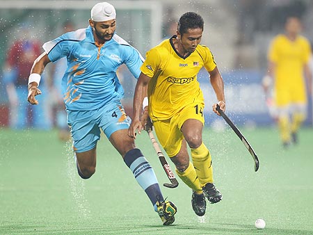 India's Sandeep Singh, left, in action