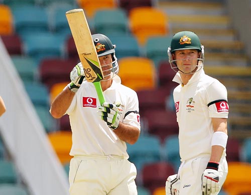 Ricky Ponting asks for the Decision Revision System as his partner Michael Clarke, right, looks on