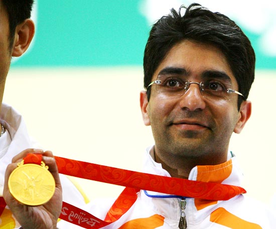Abhinav Bindra poses with the gold medal he won in the men's 10m air rifle at the 2008 Beijing Olympics