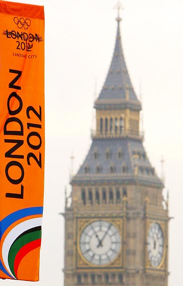 A London 2012 Olympic Games banner flutters in the wind with Big Ben in the background