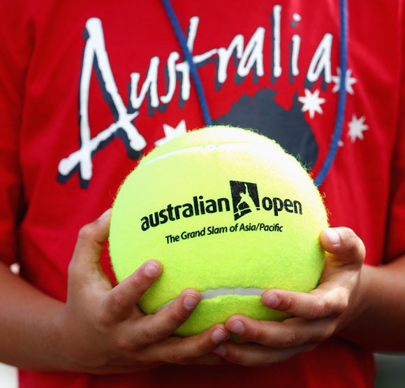 A fan holds an Australian Open Ball