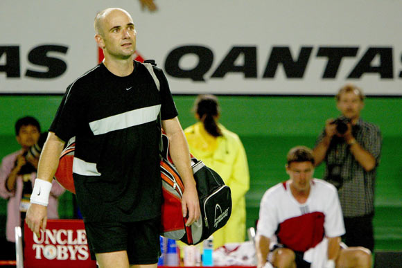 Andre Agassi of the USA leaves the court after losing his match against Marat Safin of Russia during day eleven of the Australian Open Grand Slam at Melbourne Park