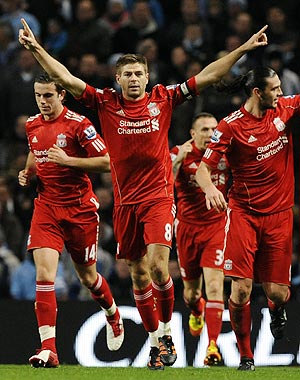 Liverpool's Steven Gerrard (2nd from left) celebrates his goal against Manchester City during their English League Cup semi-final on Wednesday