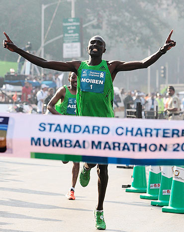 Kenya's Laban Moiben crosses the finish line at the Mumbai Marathon on Sunday
