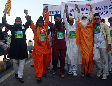 Participants take the unity in diversity theme on to the roads during the Mumbai Marathon on Sunday