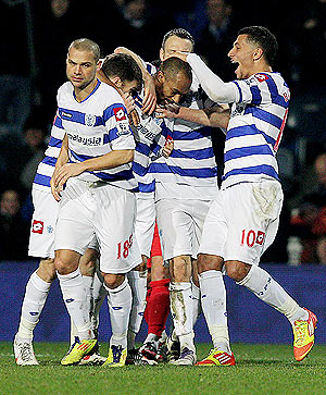 QPR's Danny Gabbidon (centre) is congratulated by teammates after scoring the opening goal against MK Dons during their FA Cup match on Tuesday