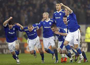Cardiff City players rejoice after winning the match