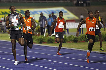 Usain Bolt (left) and Yohan Blake (right) compete in the men's 200 meters final at the Jamaican Olympic trials in Kingston