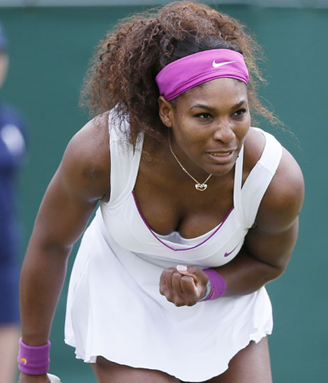 Serena Williams of the U.S. reacts to winning a point during her women's singles tennis match against Yaroslava Shvedova of Kazakhstan at the Wimbledon tennis championships in London